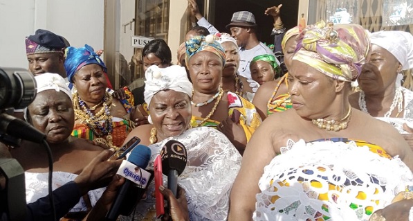 Abena Serwaa (arrowed), the Tomatoes Queenmother of Kumasi, speaking with journalists after picking the forms