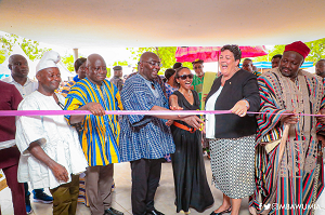 Dr Mahamudu Bawumia (2nd from left), Vice-President, being assisted by Virginia E. Palmer, (2nd from right) the US Ambassador to Ghana, and other dignitaries to inaugurate the office building