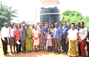 Staff of VRA and Project Maji with some members of an impacted community after commissioning of a solar-powered mechanised borehole