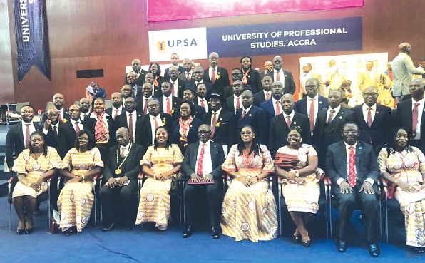 Sena Dake (4th from left ), President of ICAG,  Kwasi Agyemang, CEO of ICAG, and other Council Members of ICAG, with newly inducted fellows of the institute during the 41st Graduation and Admission ceremony of ICAG