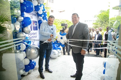 Alberto Lotz (left), Head of Training, Coral Brazil, and Luiz Carlos da Silva, Business Development Manager, Coral Paints, cutting a tape to officially open the new Coral Dulux Training Centre at Adabraka