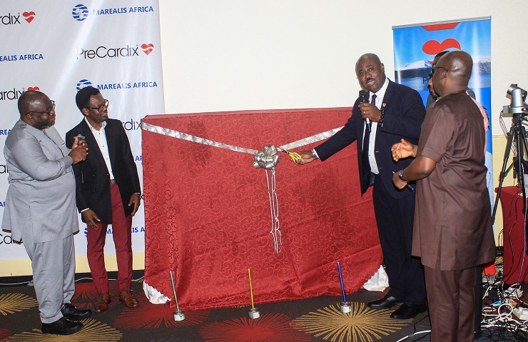 Prof. Patrick Adjei (2nd from right), Consultant and Neurologist, KBTH, cutting the ribbon and declaring the the Precardix product duly launched. With him are Adom Dennis (left), CEO, Marealis Africa, and other dignitaries
