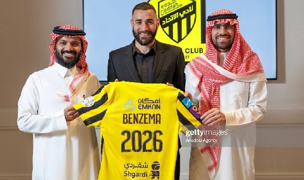 Karim Benzema (middle) displaying his signed jersey after the completion of the deal