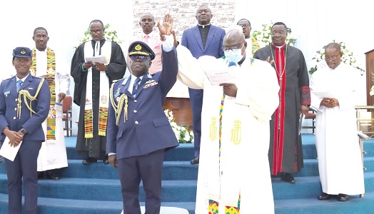 Rev. Cdre Paul Adjei-Djan (right), Director-General, Department of Religious Affairs, Ghana Armed Forces, introducing Air Vice Marshal Frederick Asare Kwasi Bekoe (left), Chief of Air Staff, after inducting him into office. Picture: ELVIS NII NOI DOWUONA