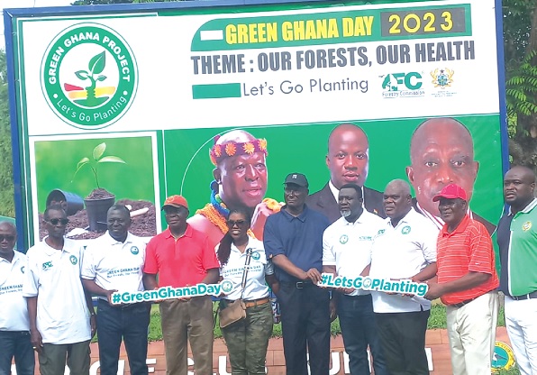 Otumfuo Osei Tutu II (4th from left), the Asantehene, with officials of the Forestry Services Division during the tree planting exercise