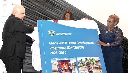 Cecilia Abena Dapaah (right), Minister of Sanitation and water Resources, being assisted by Saroj Kumah Jha, Global Director for Water Practice Group, to launch the WASH Sector Development Programme.  Picture: EBOW HANSON 