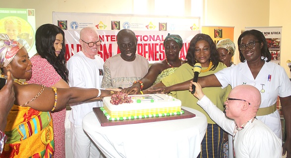Otiko Afisa Djaba (3rd from right), CEO of the Henry Djaba Memorial Foundation, being assisted by Cecilia Amakwah (2nd from left), ENA Country Director, and other dignitaries to cut the commemoration cake.  Picture: ESTHER ADJORKOR ADJEI