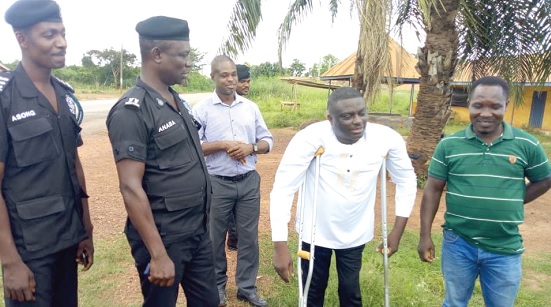 Kofi Vinyo (2nd from right), Businessman; Superintendent Enoch Anaba (2nd from left), Odomase District Police Commander, and Kwasi Agyemang (right), Director of the Kwasi Agyemang Construction Limited, interacting after the sod-cutting ceremony. With them are some policemen and a community ldeader