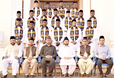 The graduates with dignitaries at the ceremony