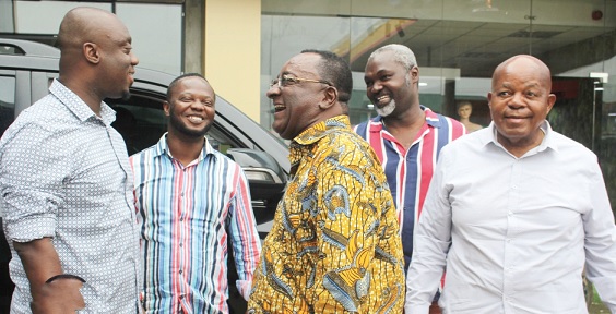 Dr Owusu Afriyie Akoto (2nd from right) interacting with Justin Frimpong Kodua (left), NPP General Secretary, and some party faithful 