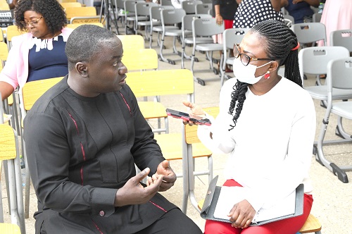 Augustina Tawiah  speaking with Dr Collins Agyemang Badu
