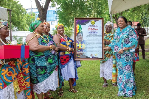  Rebecca Akufo-Addo (right), the First Lady, receiving a citation from some of the queenmothers
