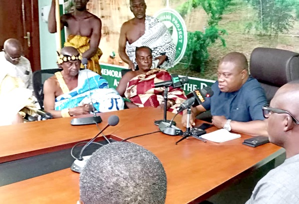 Obrempong Odiawisie Nana Amponsem Darko II (left), interacting with John Allotey (right), Chief Excecutive Officer of Forestry Commission at the meeting