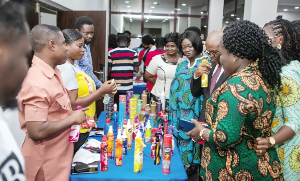Eric Amaquanor (left), CEO, Amanex Company Limited, explaining how the product is made to Dr Stephen Amoah (2nd from right), Deputy Minister of Trade and Industry, Kosi Yankey-Ayeh, CEO, GEA, and other dignitaries at the event