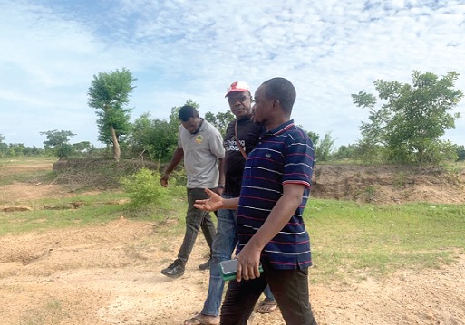 Emmanuel Lignule (right), Upper West Regional EPA Director, conducting some stakeholders around impacted areas