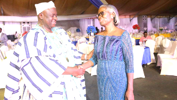 • Rev. Mrs Rosemargaret Esubonteng, the immediate past President of the Institution of Surveyors, exchanging pleasantries with Alhaji Dauda Sulemana Mahama at the investiture of the new executive of the institution