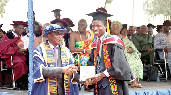 Wilfred Kwabena Anim-Odame (left), Council Chair, Accra Technical University, presenting the Overall Best Graduating BTECH Student award to Addison Fiawogbe. Picture: ELVIS NII NOI DOWUONA
