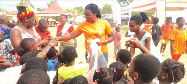 • Members of the GOIL team distributing food to the Appiatse community members during the Val’s Day engagement