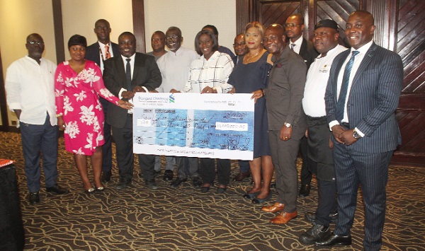 Prof. Douglas Boateng (4th from left), acting Board Chair of Hotel Investment Ghana Limited, David Eduaful (3rd from right), acting Managing Director of Labadi Beach Hotel, and Joseph Appau Boateng (3rd from left), Senior Investment Analyst, SSNIT, displaying the dummy cheque at the event. Picture: ESTHER ADJORKOR ADJEI