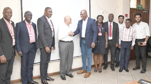 •  Ato Afful (5th from left), Managing Director, GCGL, in a handshake with Las Gokaldas (4th from left) Chairman of GOKALS Group of Companies, during the visit. With them are some management members of the GCGL. Picture: EBOW HANSON