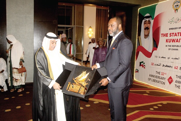 • Mohammed Abdullah Alkhaledi (left), Ambassador of the State of Kuwait, presenting a symbolic gift to Dr Matthew Opoku Prempeh at the anniversary. Picture: ESTHER ADJORKOR ADJEI