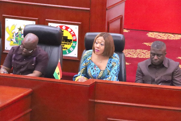 Mrs Jean Mensa (middle), Chairperson, EC, speaking at the chamber of Parliament in Accra, flanked by Prof. Ken Attafuah (left), Executive Secretary, NIA, and Dr Eric Bossman Asare (right), Deputy Chairman, EC. 