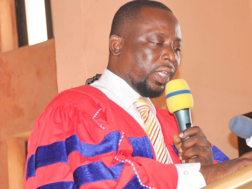 •  INSET: Dr Dickson Tsey, Principal of Amedzofe College of Education, administering the matriculation oath