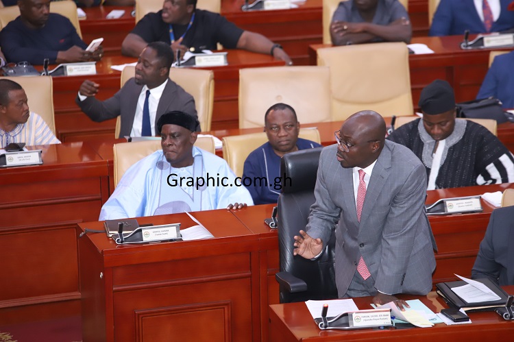 • Dr Cassiel Ato Forson (right), the Minority Leader, making a point in Parliament yesterday. Picture: SAMUEL TEI ADANO