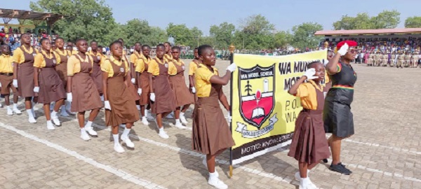 • The contingent from the Wa Model Girls JHS taking the salute during the parade