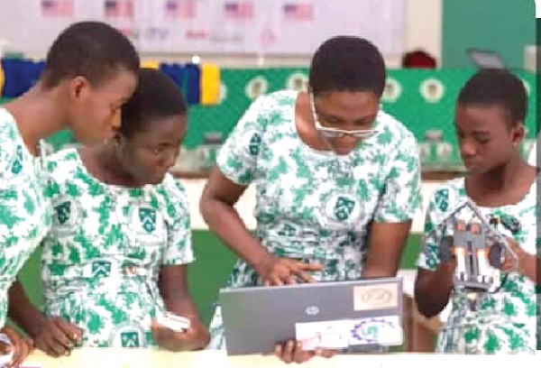 Schoolgirls working with a laptop