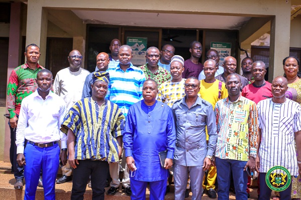  Kwasi Adu-Gyan (3rd from left), Bono East Regional Minister, with the MDCEs and other officials of the Regional Coordinating Council after the signing of the performance contracts