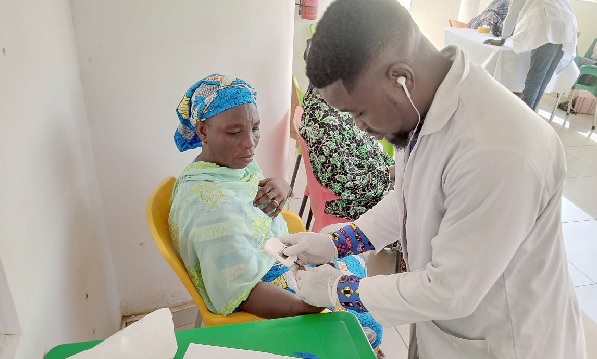 • A health practitioner attending to a resident