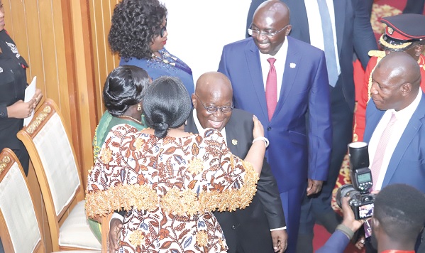 • President Nana Addo Dankwa Akufo-Addo (arrowed) embracing Rebecca Akufo-Addo (left), the First Lady, after the SONA in Parliament. Picture: SAMUEL TEI ADANO