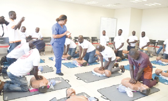 Dr Gladys Nuamah (arrowed), Deputy Director, Medical Training and Simulation Centre, University of Ghana Medical Centre, taking the drivers through the cardiopulmonary resuscitation exercise. Picture: Maxwell Ocloo