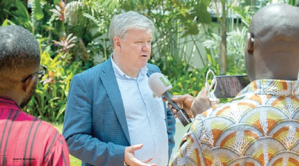 • Tom Norring (middle), Danish Ambassador to Ghana, speaking with some journalists 