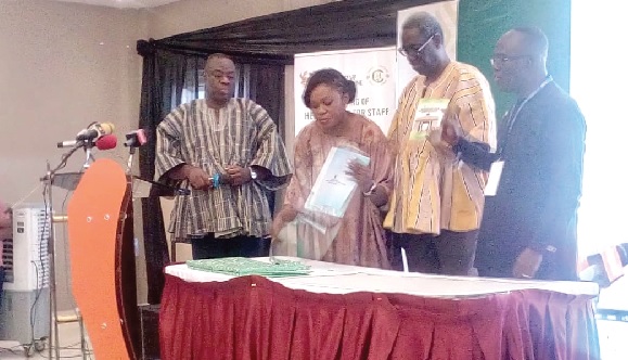 •Kwasi Kwaning Bosompem (right), Controller and Accountant General, being assisted by Nana Kwasi Agyekum Dwamena (2nd from right), Head of Civil Service, Henrietta Lamptey (2nd from left), a representative of the Registrar of Births and Deaths, and Dr Ibrahim Mohammed Awal  (left), Minister of Tourism, to present the three new documents