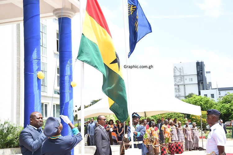 Mr Thomas Mbomba and Mr Theophile Rurangwa hoisting their respective flags