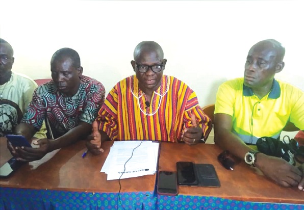 Zumah Tii-roug (middle), a member of NAPAIC-GHANA, speaking at the press conference