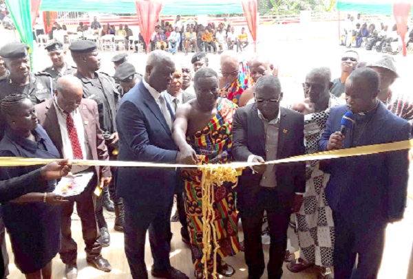 Nana Nkansah Ababio (arrowed), Edwenase Wiosohene, being supported by Justice Anin Yeboah (left) and  Richmond Agyenim Boateng (middle), MCE for Kwadaso, to cut the tape to inaugurate the courthouse