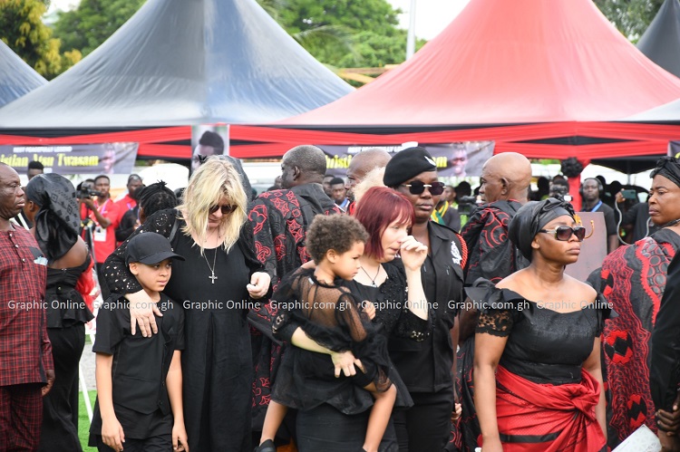 Atsu's wife overcome by emotion at his burial