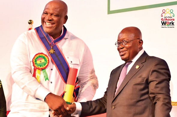 • President Akufo-Addo presenting the Order of the Volta-Companion award to Henry Quartey (left), the Greater Accra Regional Minister, for the role he played in the fight against the COVID-19 pandemic