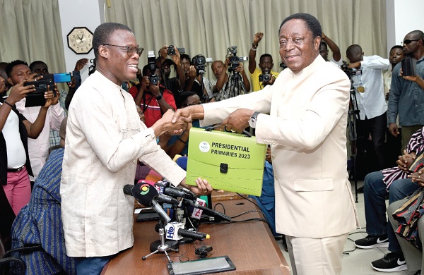 Dr Kwabena Duffuor (right) presenting his nomination forms to Fifi Fiavi Kwetey, NDC General Secretary Picture: Ebow Hanson 