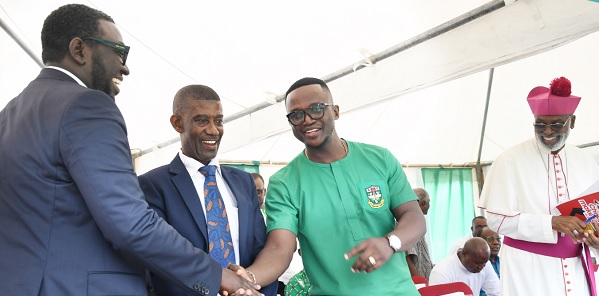 • Andrew Takyi-Appiah (left), an old student of St Augustine’s College and MD of Zeepay, congratulating Emmanuel Teye Kenney, the immediate past APSU ’98 President and CEO of FLOKEFAMA Ghana during the function. With them are Henry Arthur-Gyan (2nd from left), Headmaster of the school, and the Most Rev. Charles Gabriel Palmer-Buckle (right), the Metropolitan Archbishop of Cape Coast