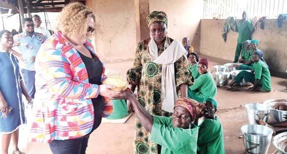• Harriet Williams (left),  Second Secretary at the Australian High Commission, receiving shea butter from some of the beneficiaries