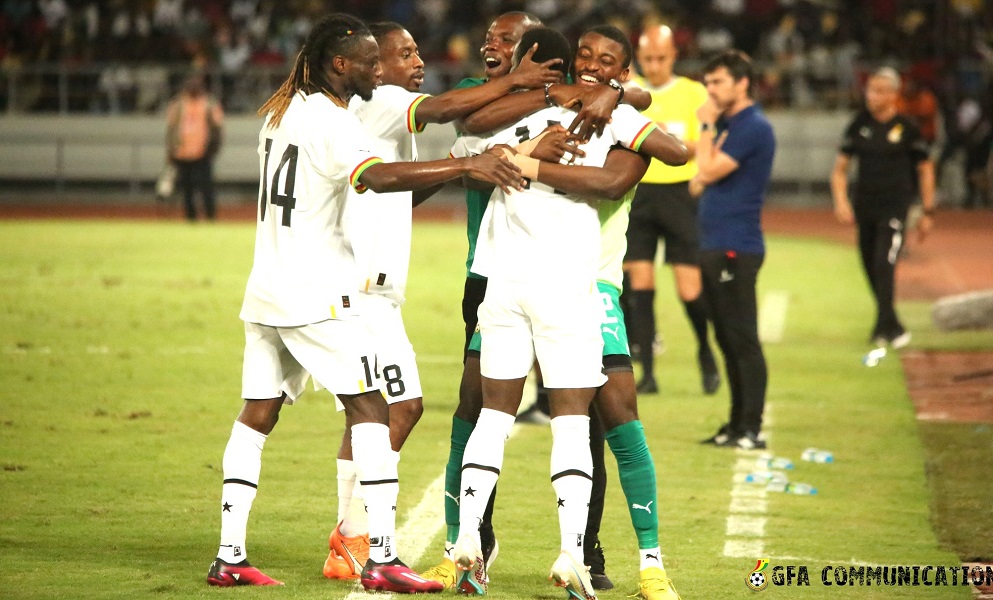 Black Stars substitute Osman Bukari is mobbed by his teammates and goalkeepers' trainer Richard Kingson to celebrate Ghana's equalising goal 