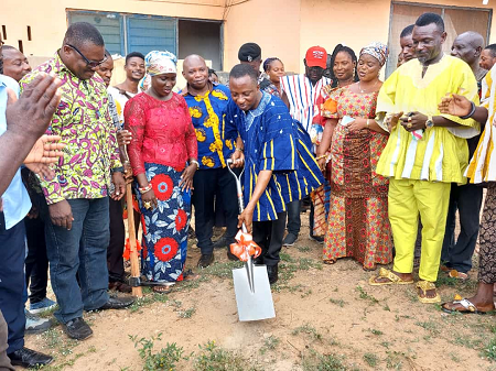 Akwasi Afrifa-Mensa (with shovel), the Member of Parliament for Amasaman, breaking grounds to begin the construction of the clinic facility