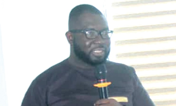 • Philip Acquah (inset), Project Manager of e-VAT, speaking at the meeting