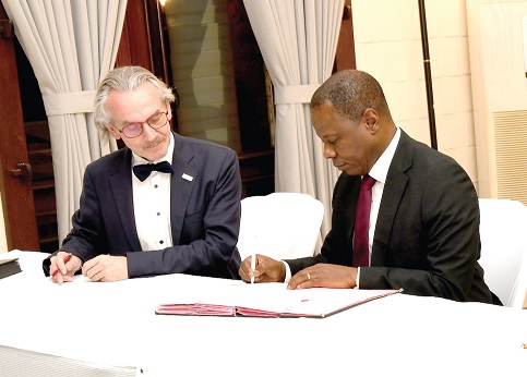 • Dr Patrick Kuma-Aboagye (right), Director-General of the GHS, signing the agreement, while Julien Lecas, Head of Cooperation at the French Embassy in Ghana, looks on. Picture: EBOW HANSON 