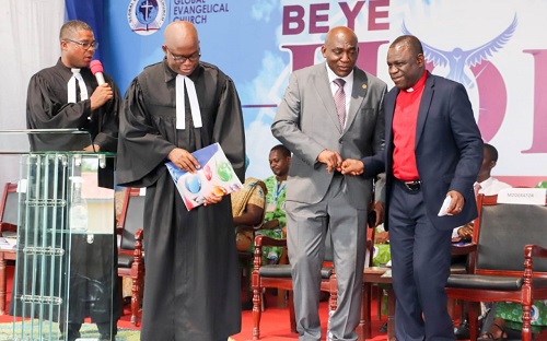 Mr Rockson Dogbegah (in gray suit), Chairman, Berock Group exchanging pleasantries with Rt Rev Prosper Samuel Dzormeku (right), Moderator, Global Evangelical Church as Rev Lawrence K.T. Ganyo look on.