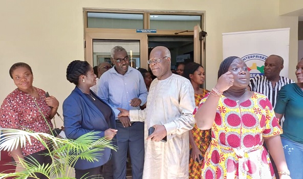 Kobina Tahir Hammond (right), Trade and Industry Minister, interacting with Kosi Yankey-Ayeh (middle), CEO, GEA, and beneficiaries of the training during the familiaris­­ation tour